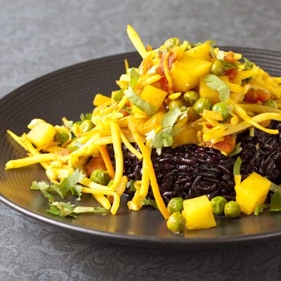 Curried cabbage with potatoes and green peas