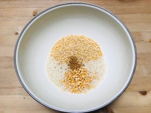 Rice and lentils in bowl to make dosa batter