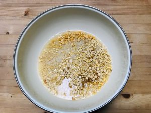 Rice and lentils in bowl after soaking overnight in water to make dosa batter